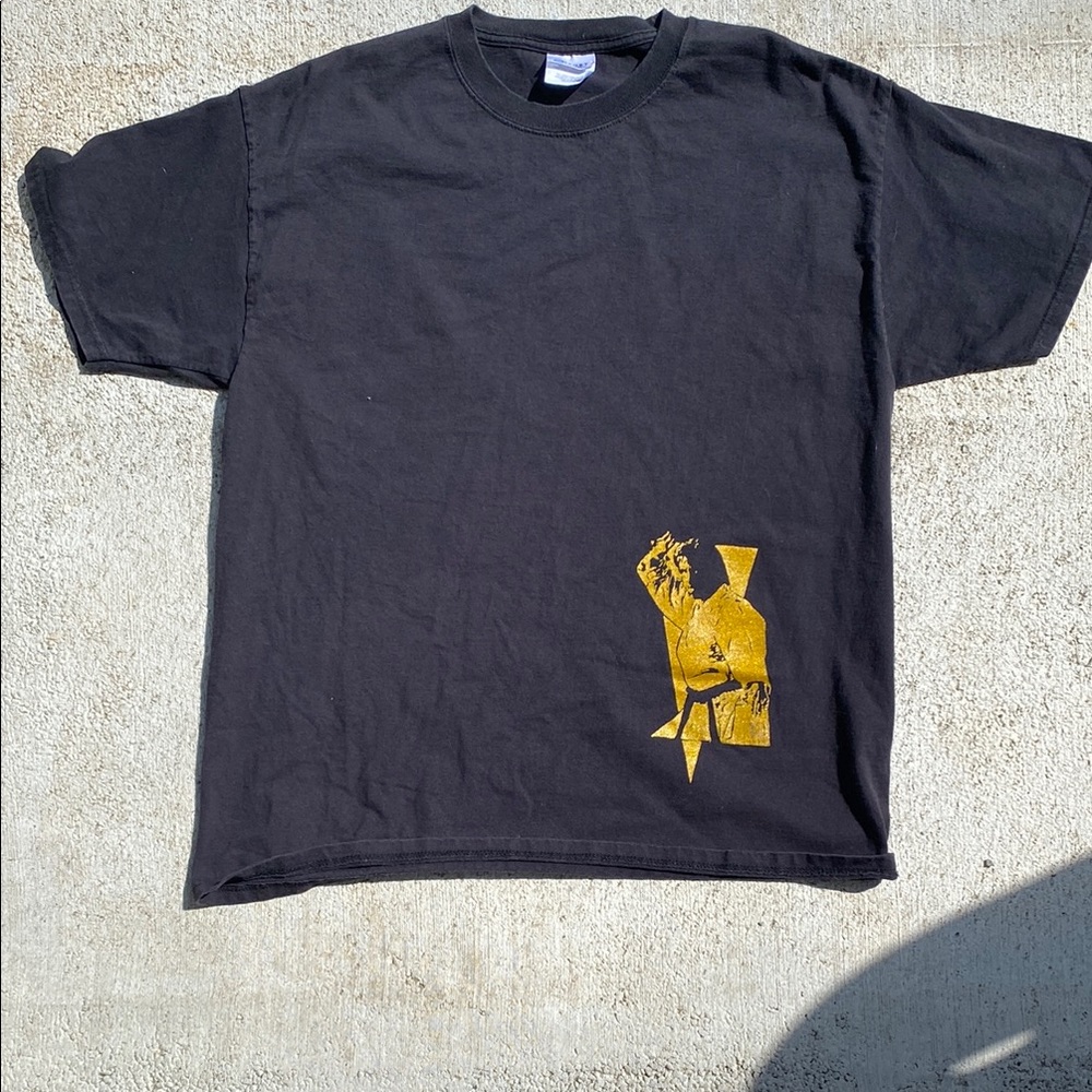 Chuck Norris Black Tee with Gold Graphic
